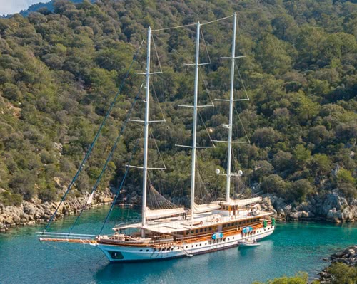 Gulet Admiral anchored in bay with tourqoise water