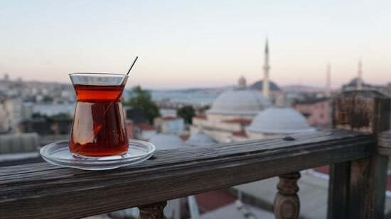 Tea on wooden rail with Istanbul city in the background