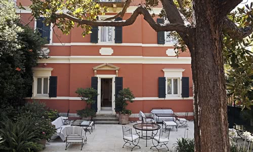 Exterior of hotel with terrace and garden