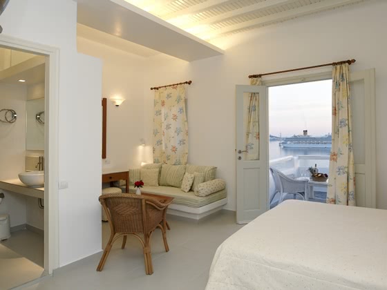 Hotel room with double bed, balcony and view out to sea