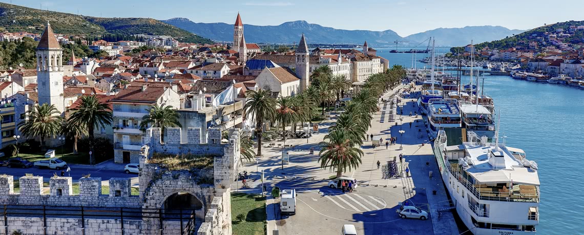 Aerial view of Trogir promenade, town and ships