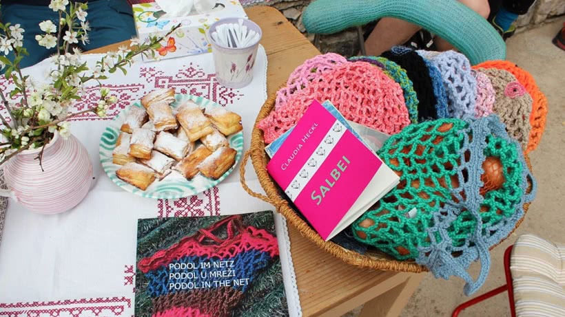 Table with net bags, books, flowers and pastries